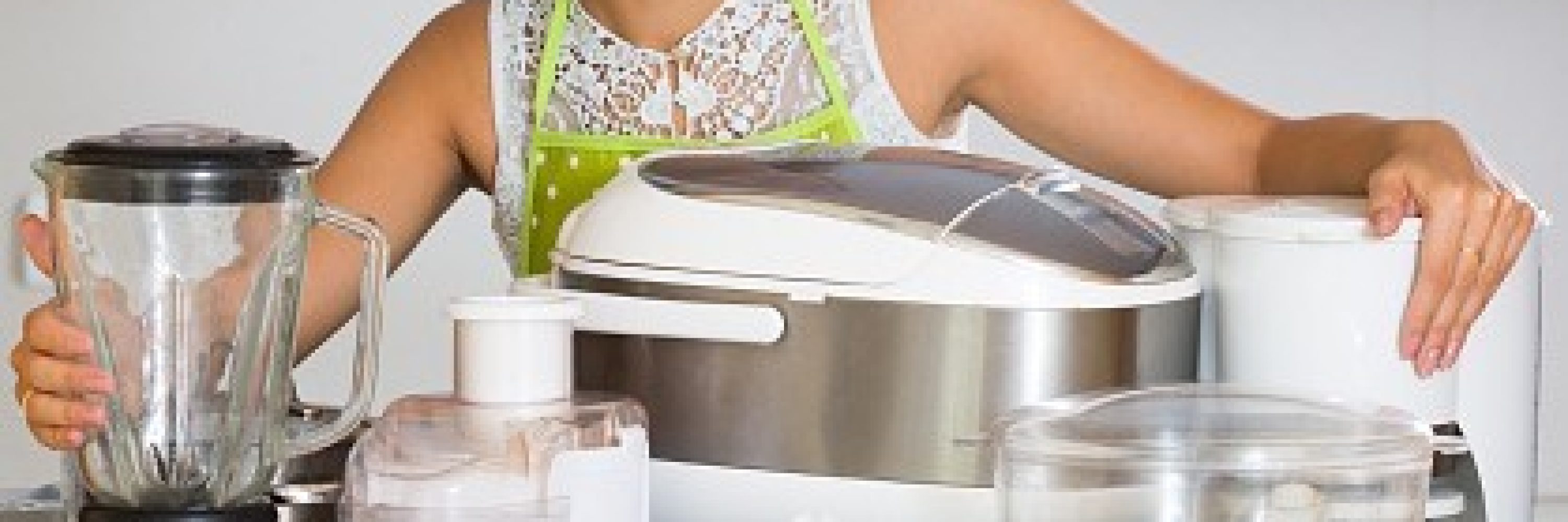 Girl with kitchen appliances at home